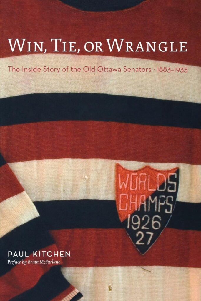 Cover of Win, Tie, or Wrangle. A colour photo of a wool hockey jersey with red, white and black stripes and a crest reading World's Champs 1926-27